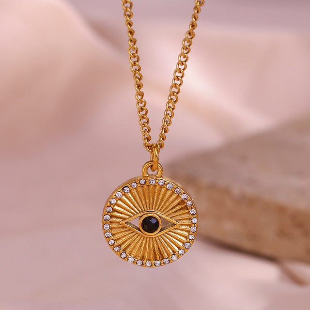 Minimalist Black Eye Pendant Necklace in Stainless Steel with 18K Gold Plating and Rhinestone Inlay, Sunburst Coin Shape