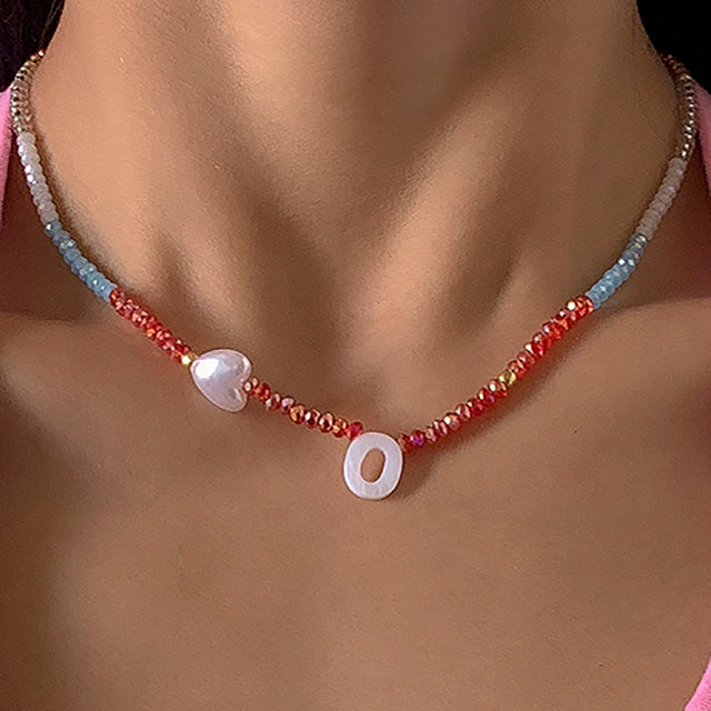Bohemian Style Letter O Necklace with Shell Pendant and Geometric Heart Design in Resin Plastic