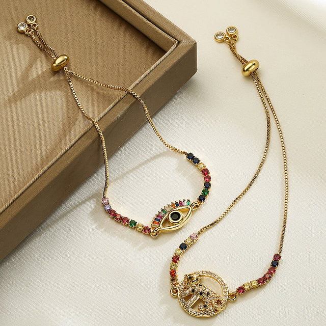Minimalist Geometric Evil Eye Adjustable Bracelet for Women with Brass Base and Gold Plating Featuring Micro-Pave Leopard Charm