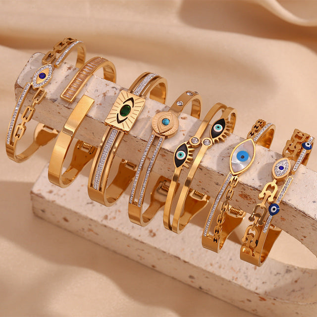 Fashionable Minimalist Stainless Steel Bracelet with 18K Gold Plating and Micro-Paved Evil Eye Charm on Spring Clasp