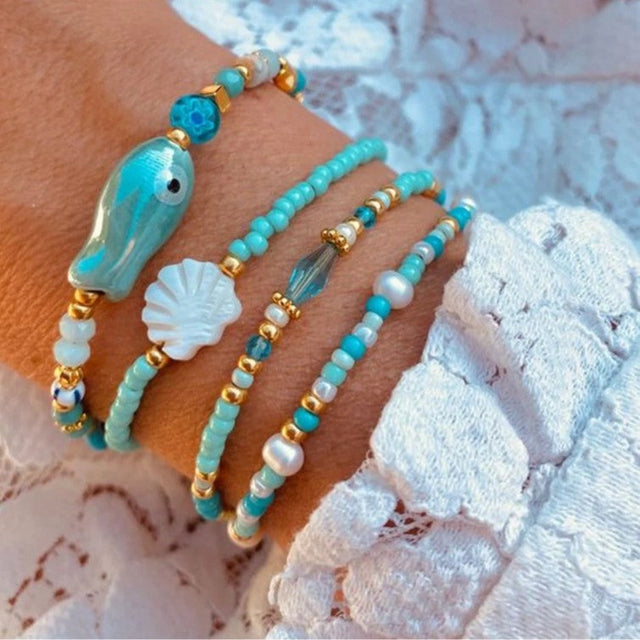 Bohemian Beach Vacation Bracelet with Ceramic Fish and Shell Charms on Multi-Layer Beaded Strand