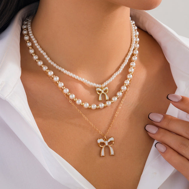Cute Bow-Shaped Pendant Necklace with Tassel Detail, Simulated Pearl and Alloy, Plated Finish, Layered Style for Women